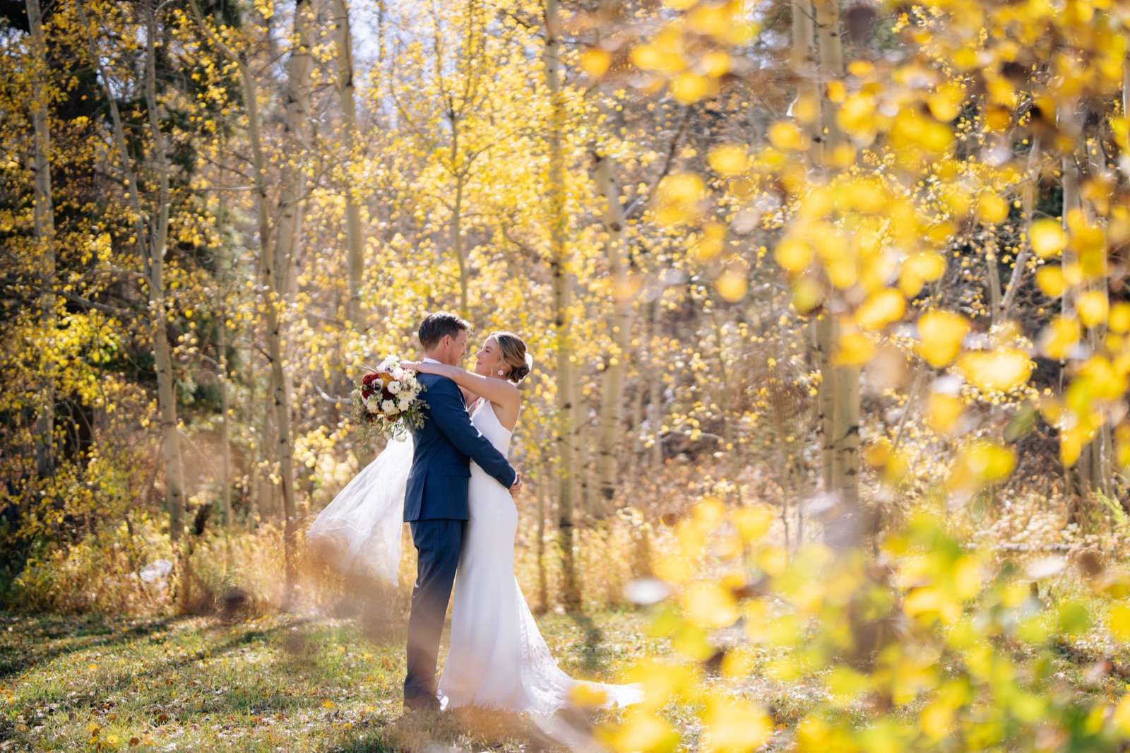 Couple among golden aspens at Beyul