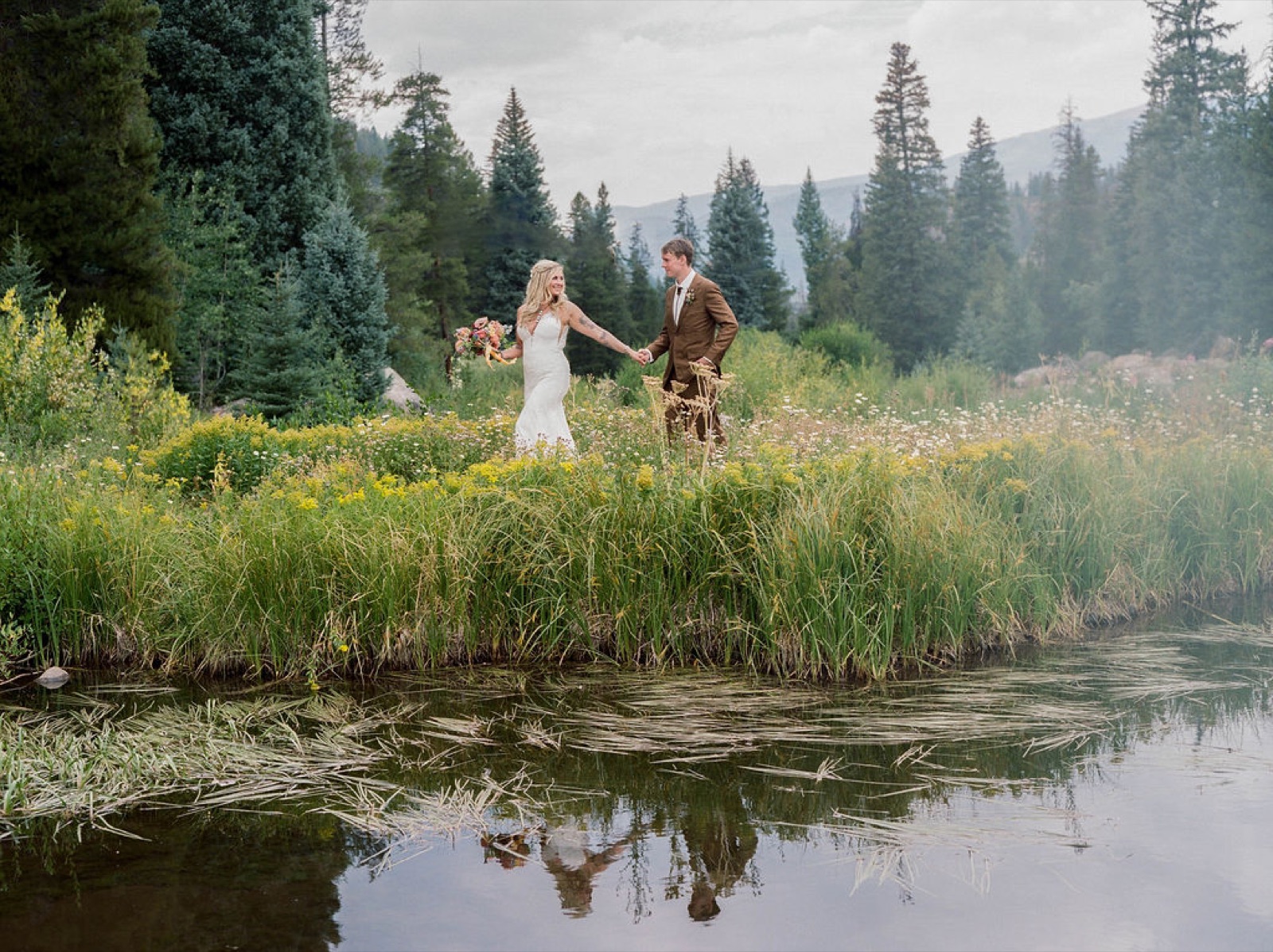 Couple walking by the pond at Beyul